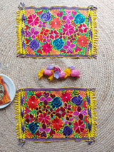 Colorful placemat (blue-red) with round floral embroidery from Mexico