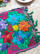 Colorful placemat (blue-red) with round floral embroidery from Mexico