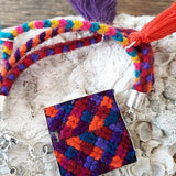 Bracelet cuadro from Mexico (handmade, pom pom purple, orange)